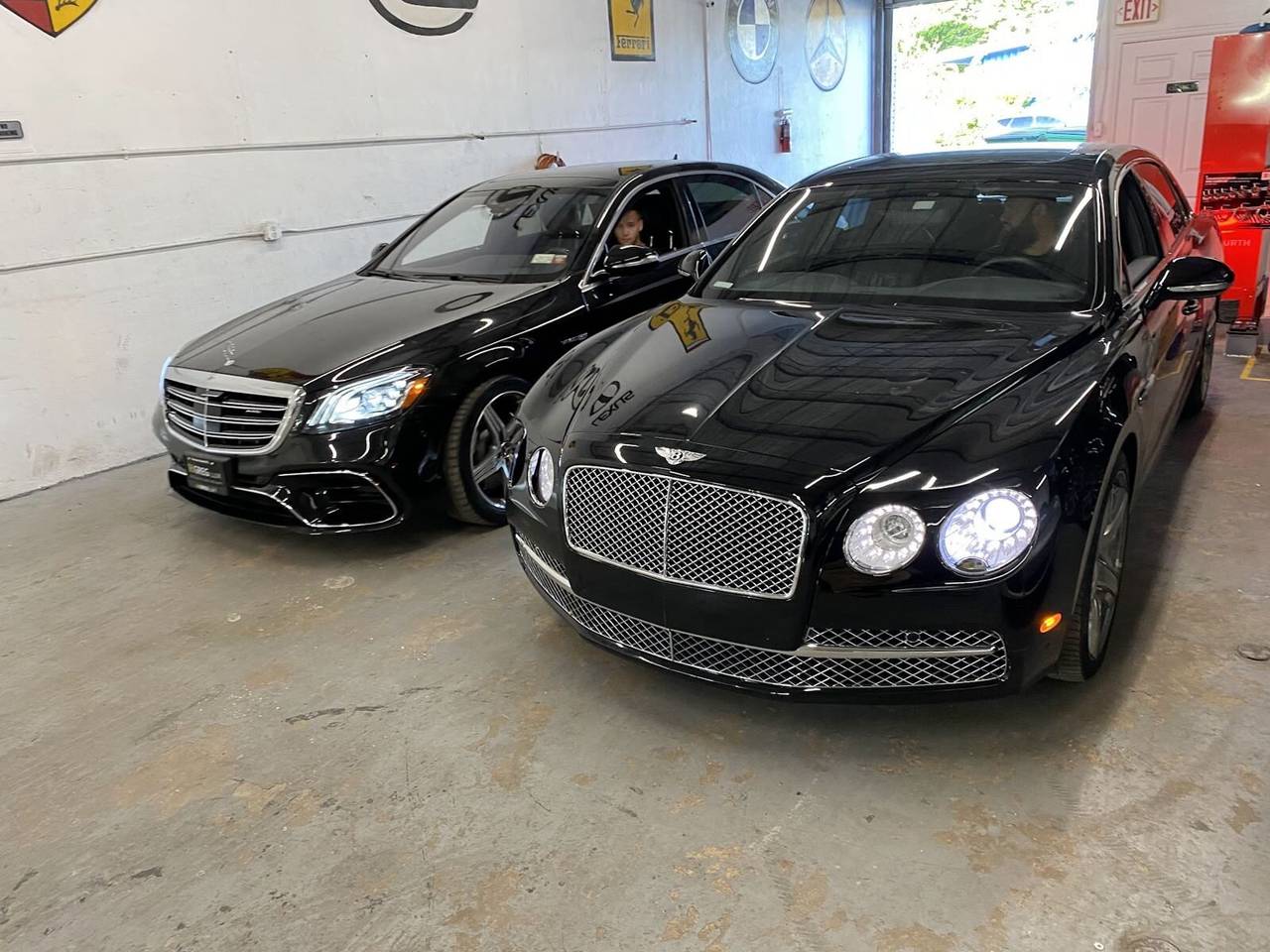 Inside the Gold Coast Collision Center repair bay in Pompano Beach: a Bentley Flying Spur and Mercedes-Benz S-Class, and a Porsche Panamera torn down for collision repair