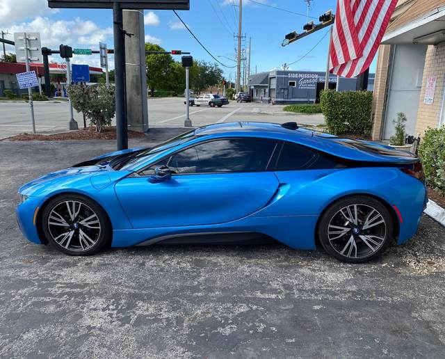 Blue BMW i8 parked outside Gold Coast Collision Center after body work