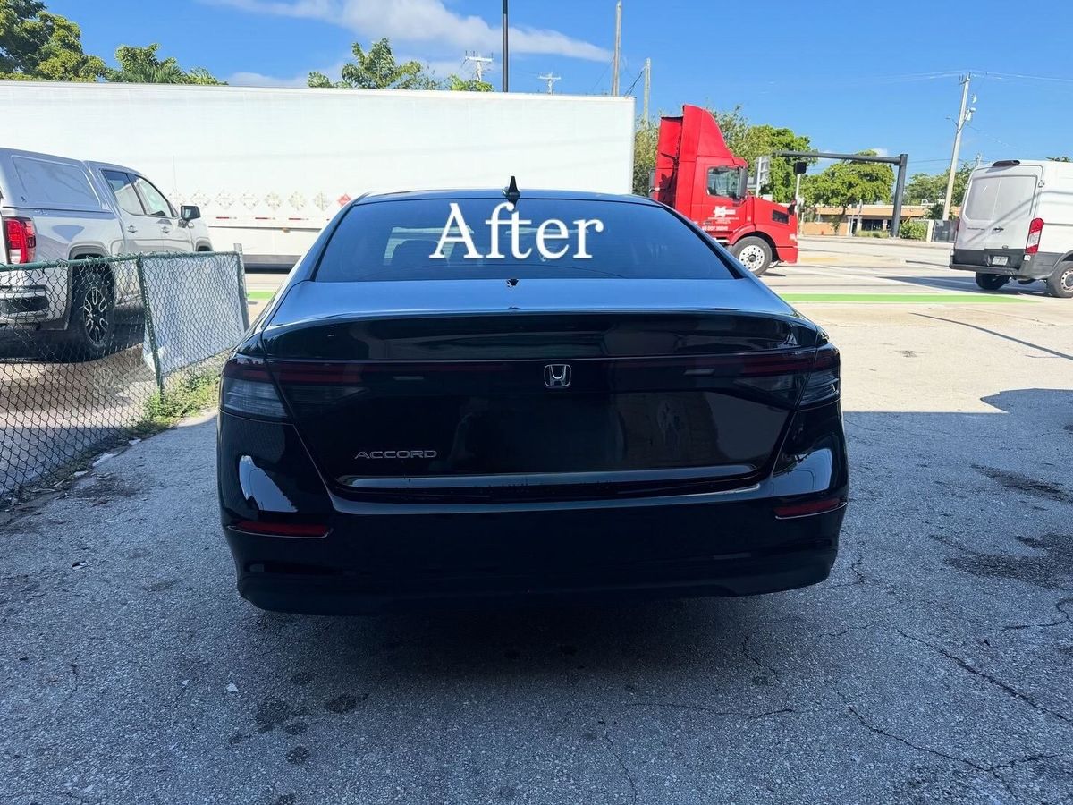 Black Honda Accord after rear collision repair outside Gold Coast Collision Center in Pompano Beach