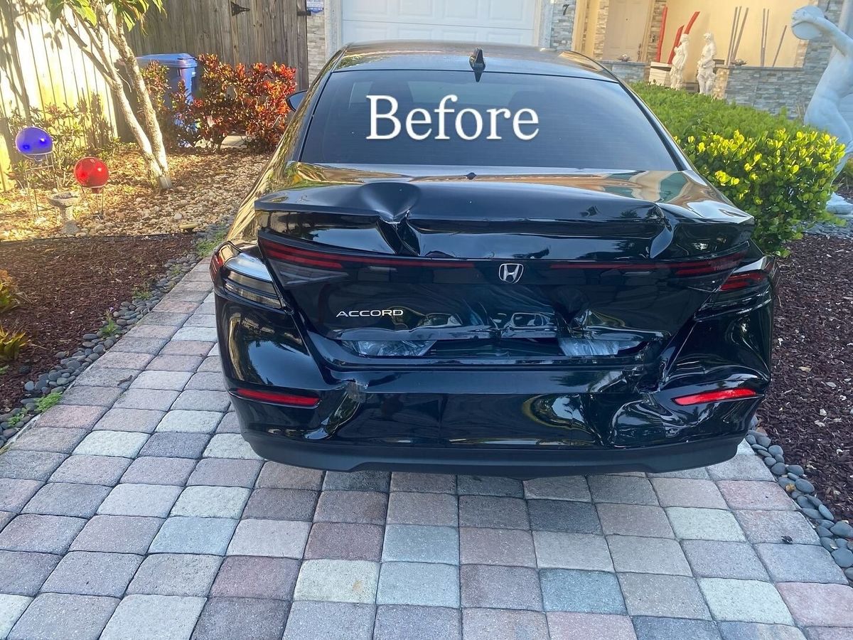 Black Honda Accord with a crushed trunk lid and rear bumper before rear collision repair by Gold Coast Collision Center